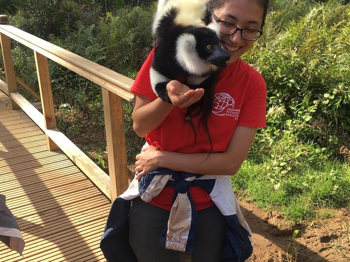 EWB-NU volunteer with a lemur on her shoulder in Madagascar